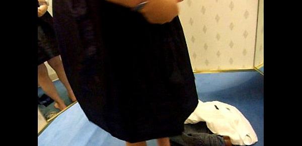  Amateur gives a blowjob in a stores dress in the dressing room